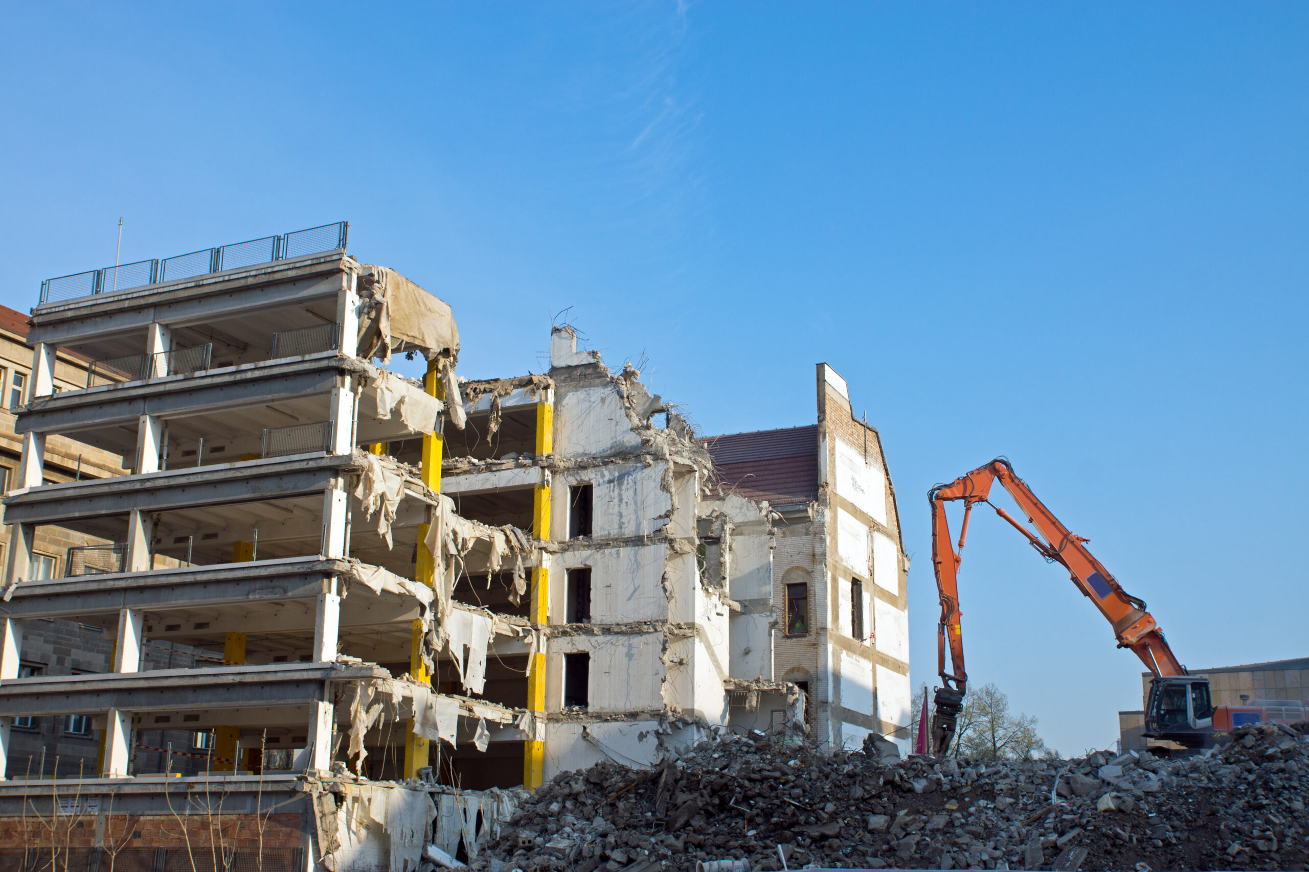 demolition-of-a-building-with-excavator-2026-01-08-07-42-26-utc