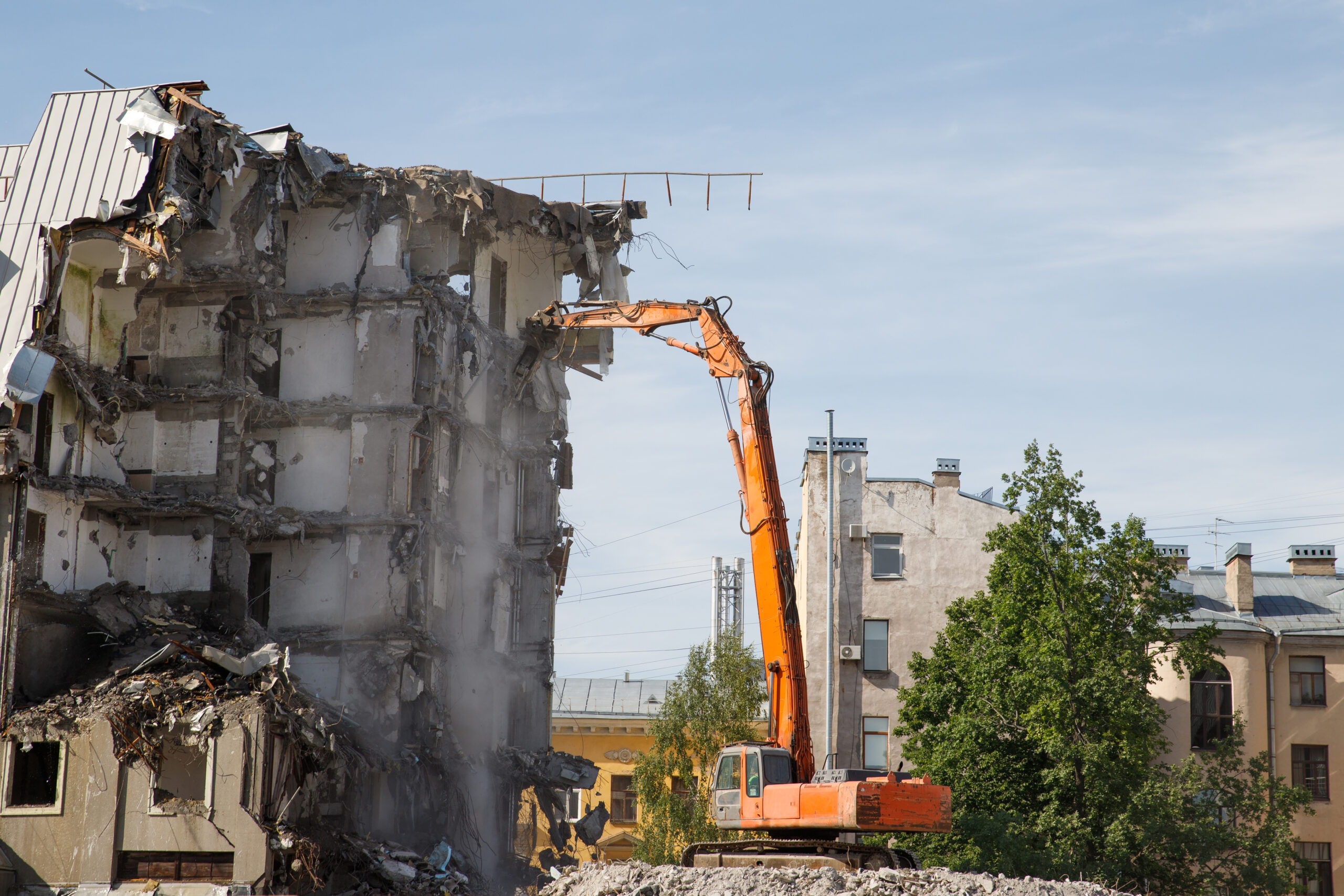 Building of the former hotel demolition for new construction, . Complete highly mechanized demolition of building structures. Construction site concept